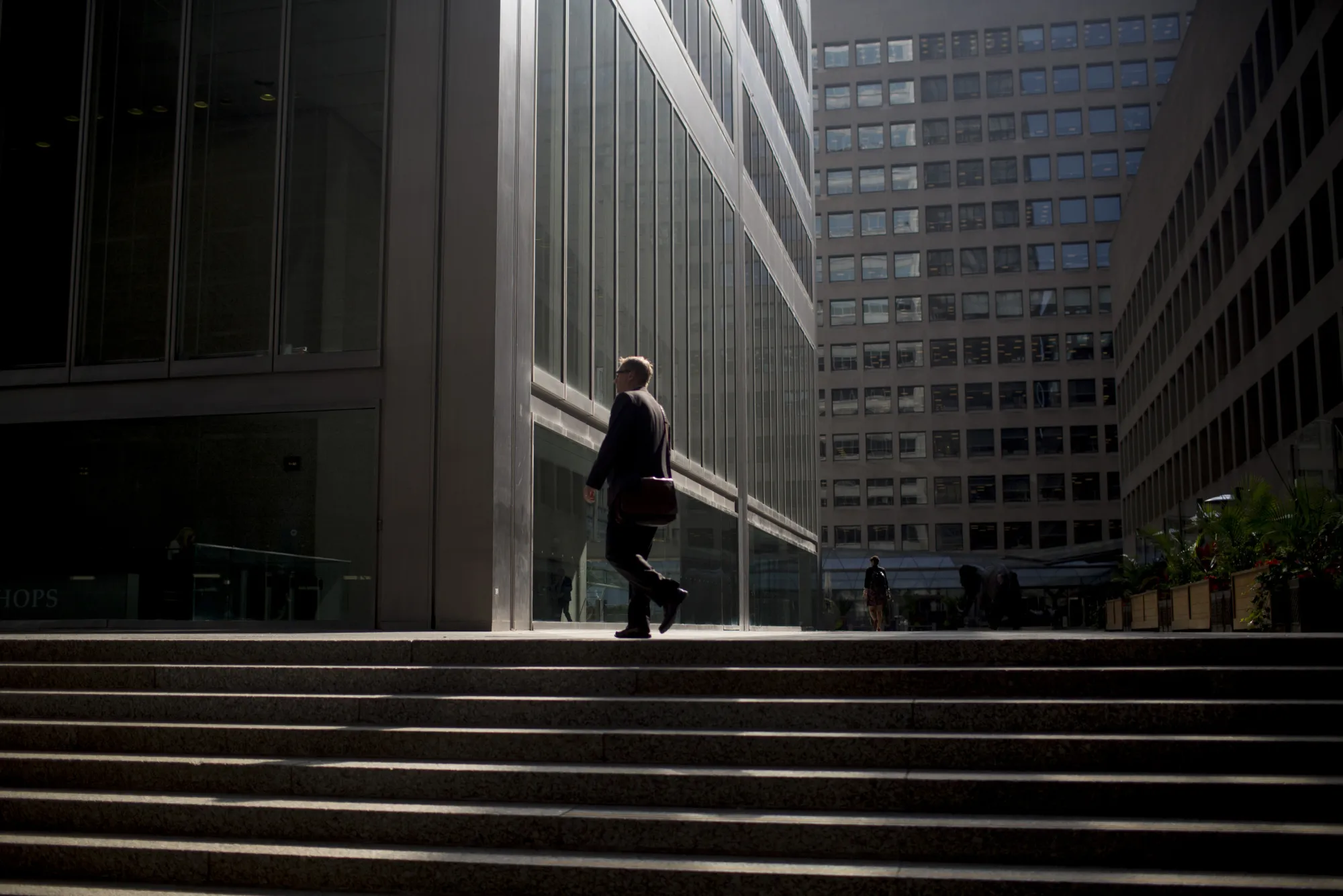 A commuter walks up stairs in the financial district of Toronto, Ontario, Canada, on Thursday, July 7, 2016.