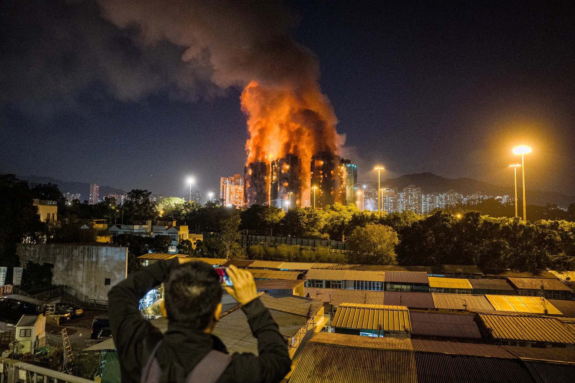 Fire engulfs apartment blocks at the Wang Fuk Court residential estate.