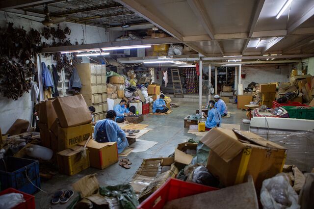 Men resume work with all Covid protection protocols in place at International Footsteps, a footwear manufacturing unit in Dharavi. 10th July 2020.
