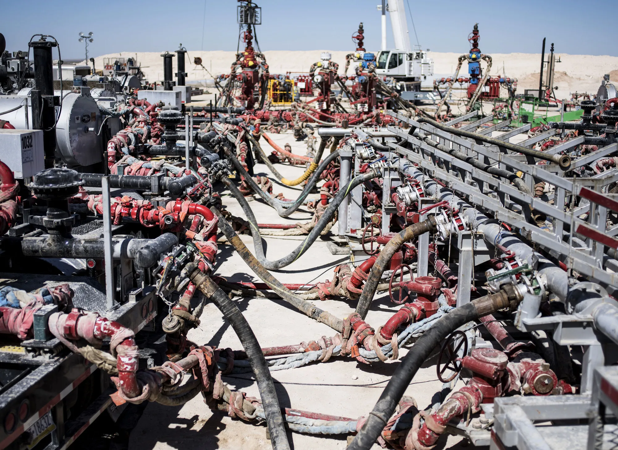 Machinery used to fracture shale formations stands at a hydraulic fracking site near Mentone, Texas.