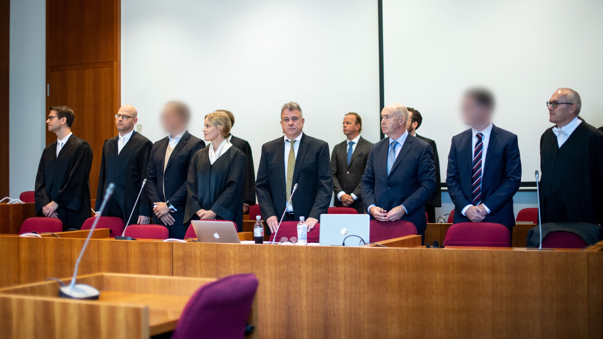 Two of the defendants, second right and third left, at the district court in Bonn, in Sept.