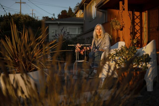 A portrait of Nelda Barchers on her outdoor deck. 