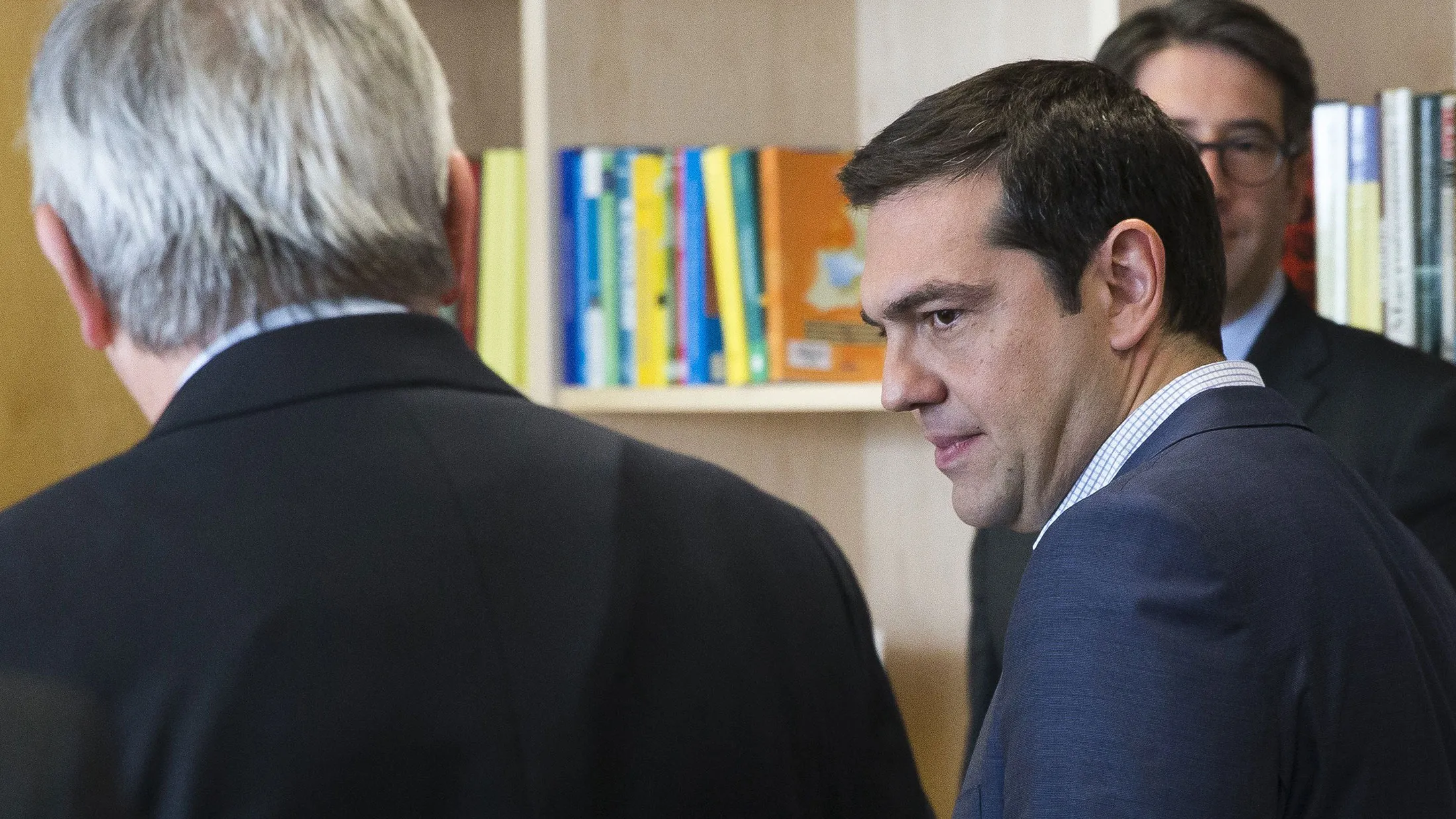 Greece's Prime Minister Alexis Tsipras, right, is welcomed by European Commission President Jean-Claude Juncker, left, ahead of a meeting on Greece, at the European Commission in Brussels, on June 24, 2015, as eurozone finance ministers try to finalise a debt deal and avoid a default by Athens.
