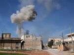 Smoke rises above the town of Saraqib in Idlib province, Syria, on Feb. 27.
