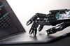 The Shadow Dexterous robotic hand, manufactured by The Shadow Robot Company, touches the keyboard of an Apple Inc.