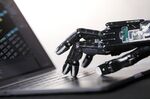 The Shadow Dexterous robotic hand, manufactured by The Shadow Robot Company, touches the keyboard of an Apple Inc.