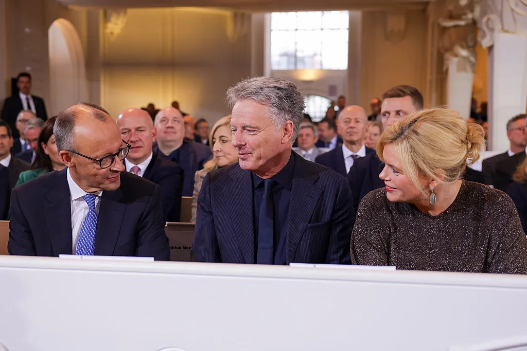 Friedrich Merz, TV host Joerg Pilawa&nbsp;and President of the German Parliament Bundestag Julia Kloeckner attend an ecumenical service during the celebrations for the Day of German Unity&nbsp;in Saarbruecken, Germany, Oct. 3.