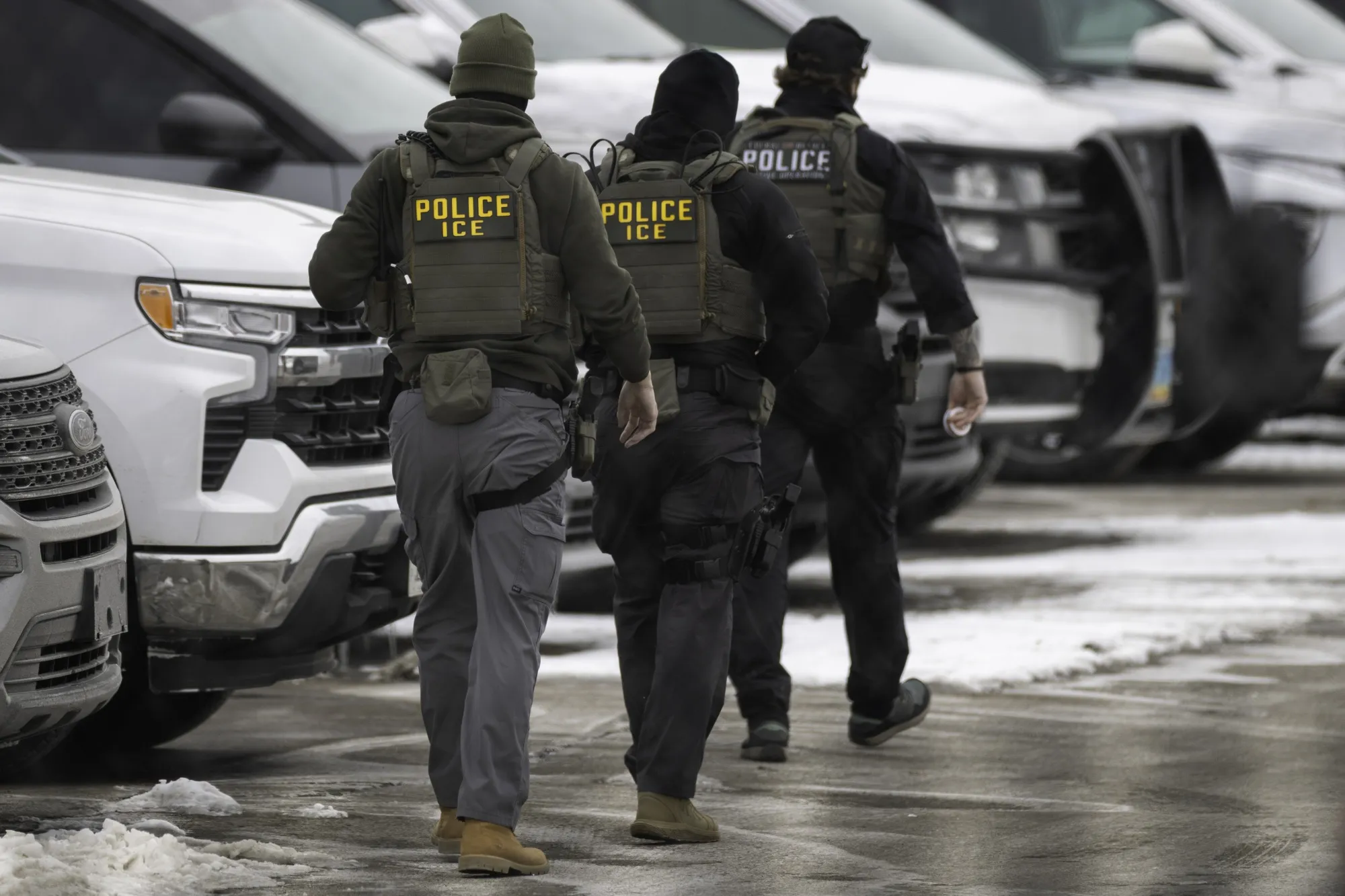 ICE agents depart the Bishop Henry Whipple Federal Building in Minneapolis on Feb. 4.&nbsp;