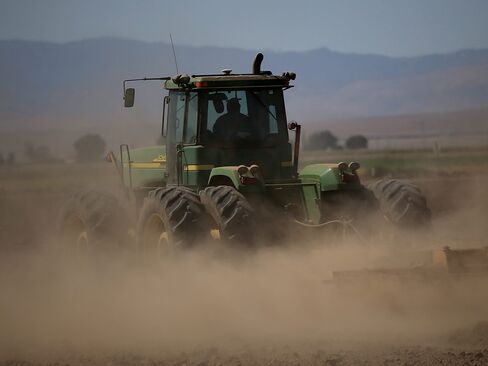 A tractor kicks up dust in Los Banos, California.