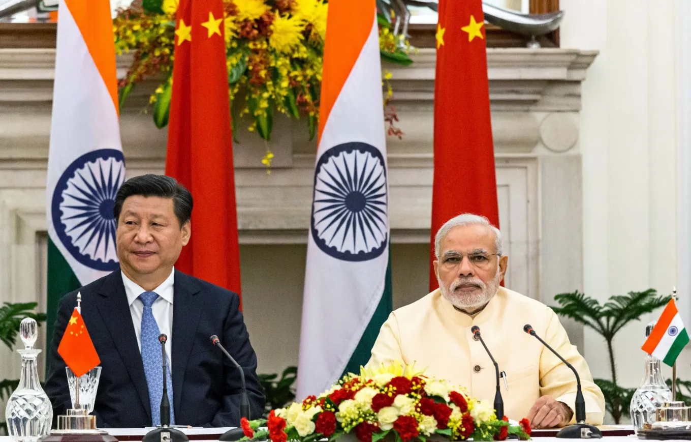 Narendra Modi, India's prime minister, right, and Xi Jinping, China's president, attend a meeting in 2014.