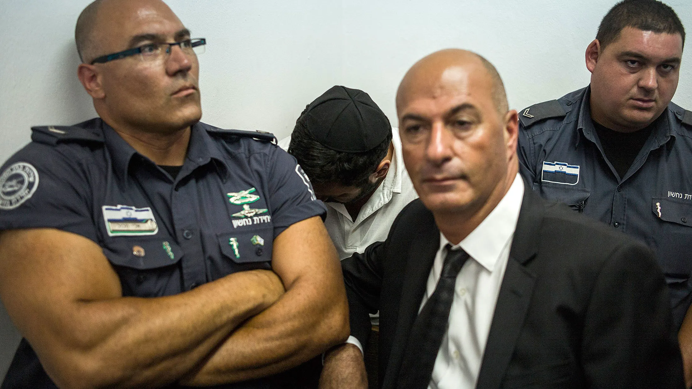 Gery Shalon, center, one of two Israeli men charged in the U.S. in connection with securities fraud.
