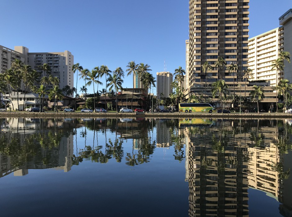 The three-block-wide tourist district of Waikīkī is bounded by the Ala Wai Canal (shown here) on one side and the Pacific Ocean on the other.