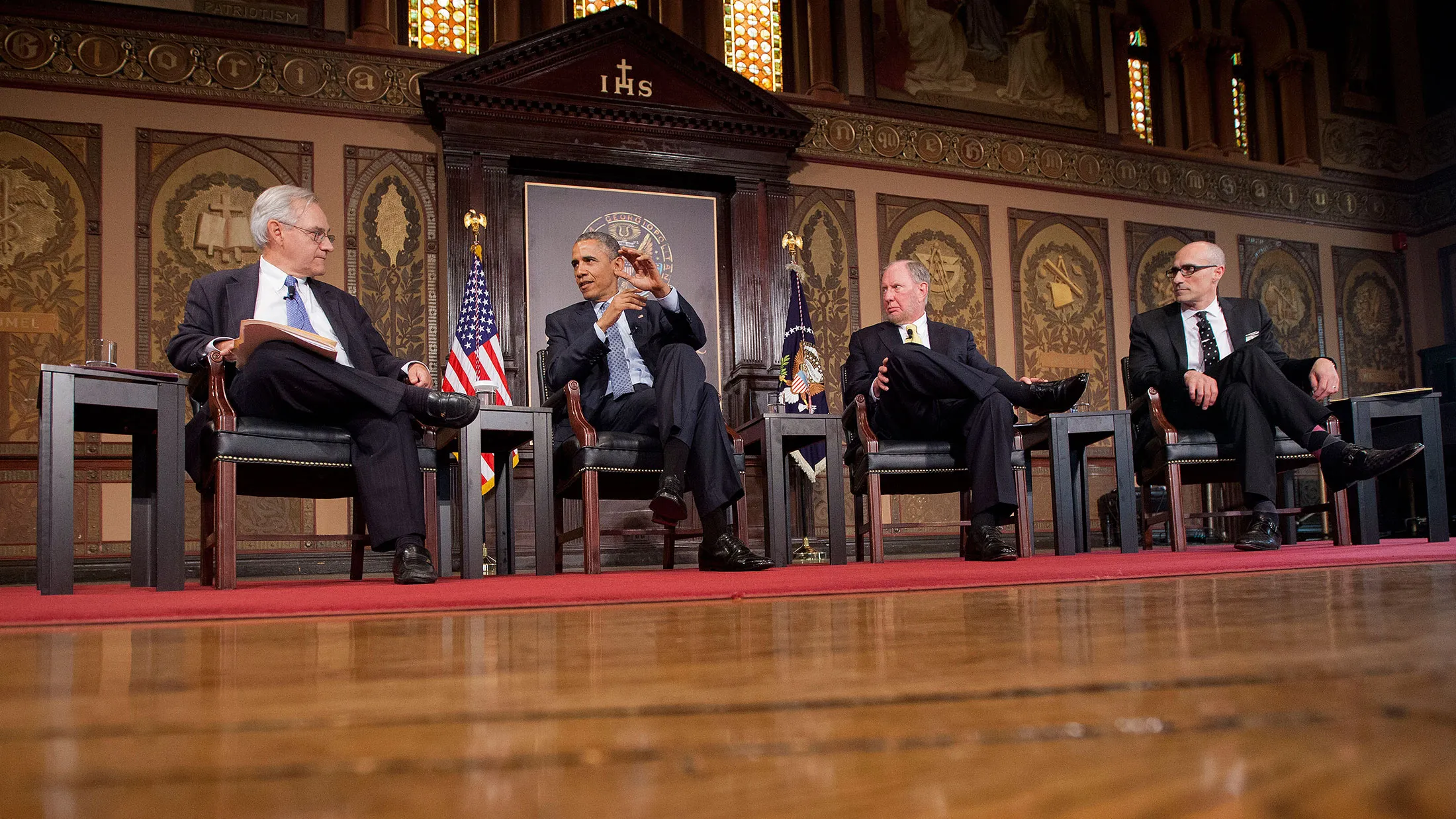 President Barack Obama speaks at the Catholic-Evangelical Leadership Summit on Overcoming Poverty at Georgetown University in Washington on May 12, 2015. From left are, E.J. Dionne, Jr., Washington Post columnist and professor in Georgetown's McCourt School of Public Policy; the president; Robert D. Putnam, Professor of Public Policy at the Harvard University John F. Kennedy School of Government; and Arthur Brooks, president of the American Enterprise Institute.
