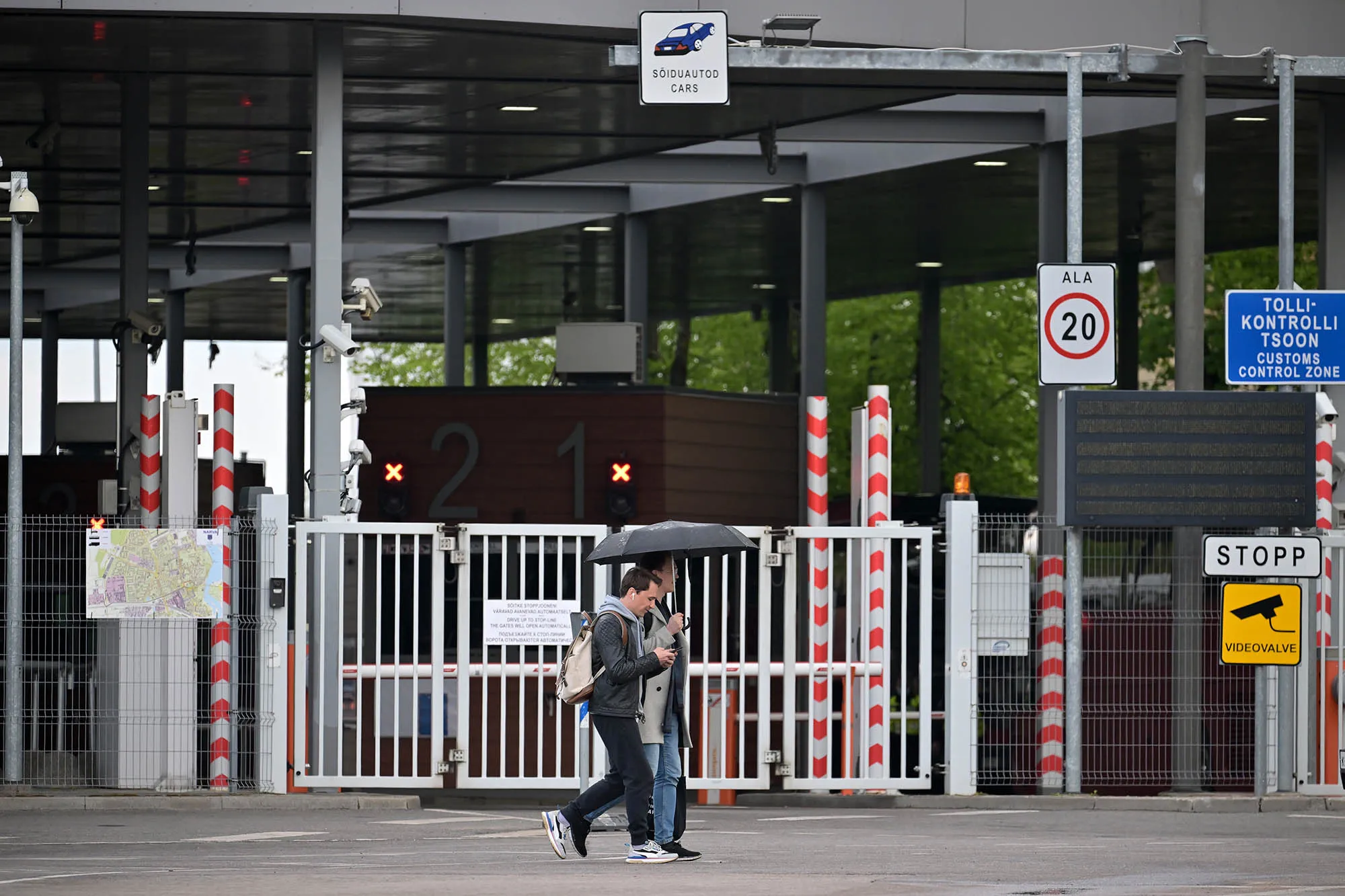People walk past the border crossing from Estonia into Russia over the Narva River&nbsp;in Narva, Estonia on May 27.&nbsp;
