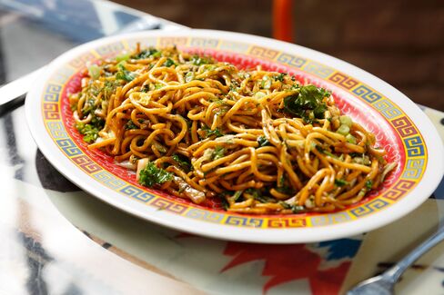 Spicy lo mein noodles with cabbage and greens (you can get it with rotisserie chicken tossed in).