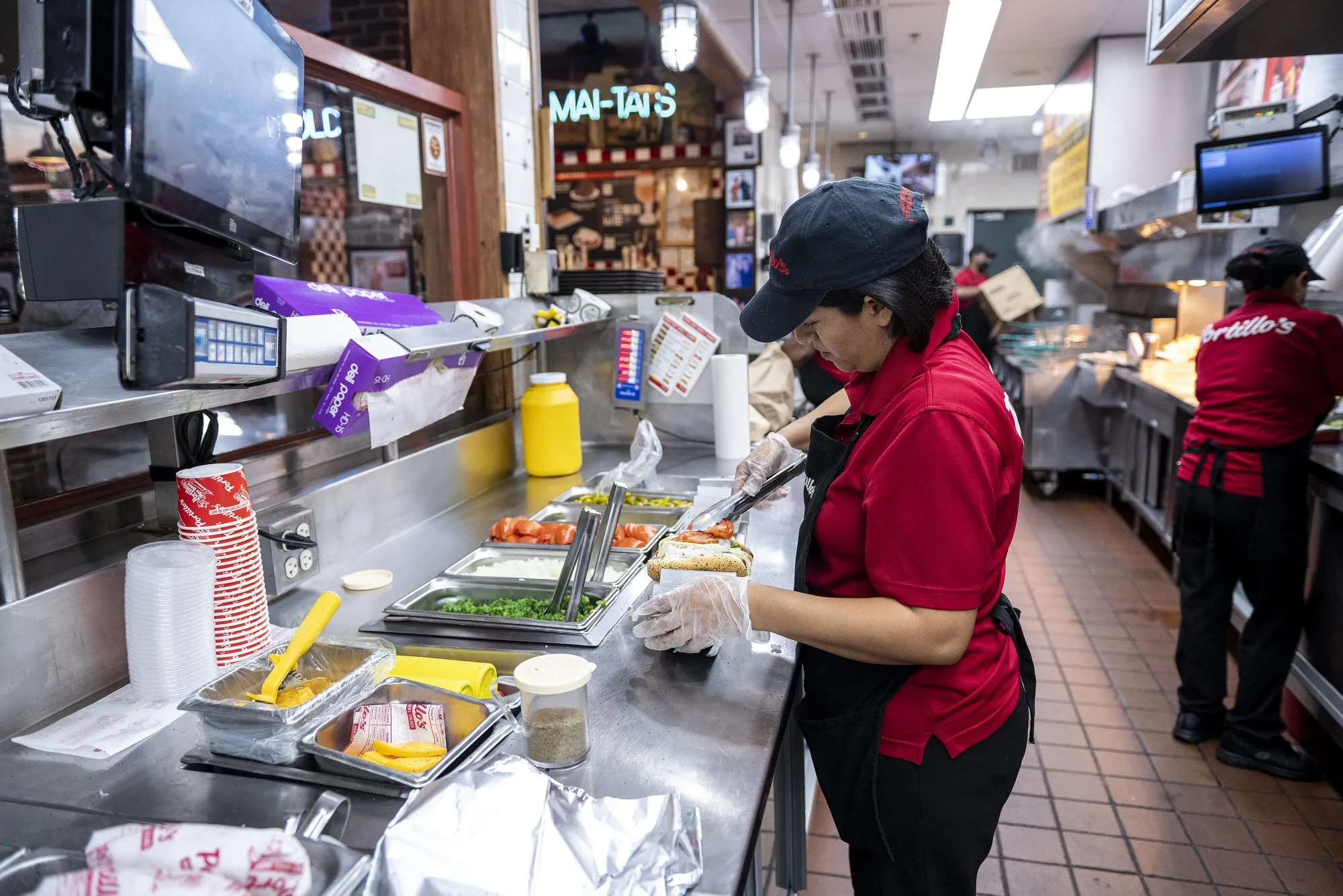 An employee prepares a hot dog&nbsp;in Chicago, Illinois.