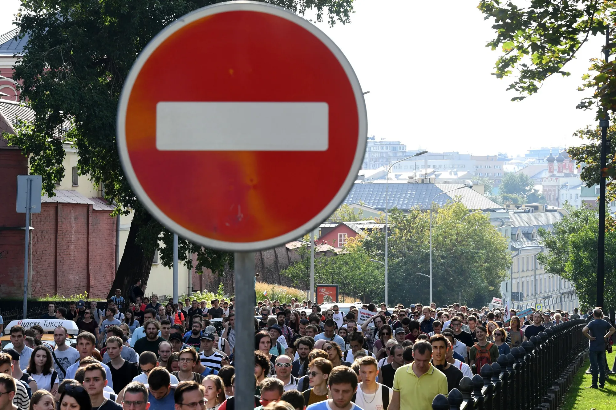Protesters walk during an unauthorised rally in&nbsp;Moscow on July 27.