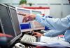 A financial trader points to data
