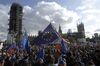 Demonstrators hold European Union (EU) on Parliament Square during a People's Vote march in London, U.K., on Saturday, Oct. 19, 2019. Boris Johnson is under pressure to ask the European Union to postpone Brexit after Parliament refused to approve the deal the prime minister negotiated.