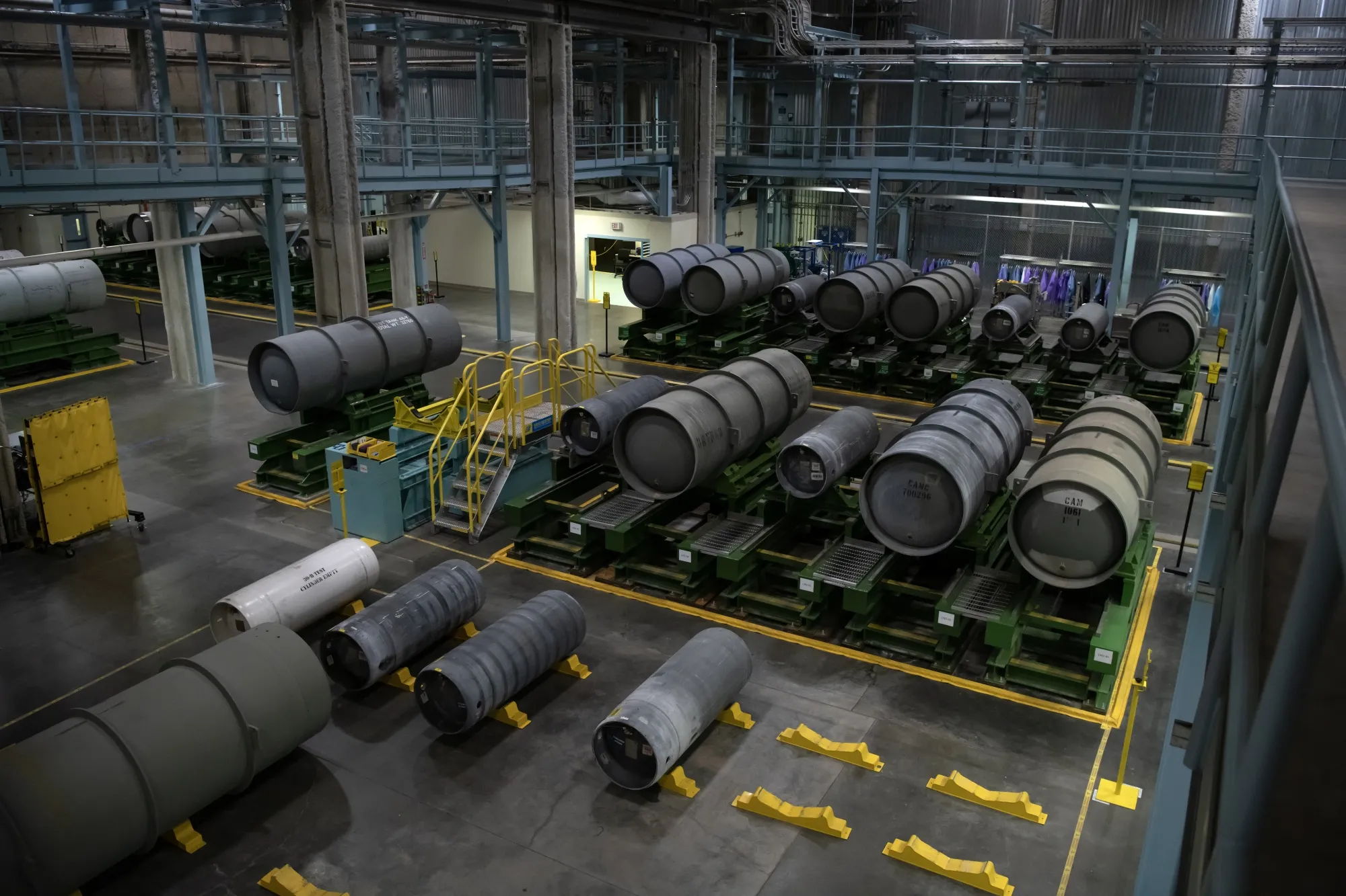 Ready-to-ship canisters filled with enriched uranium at an enrichment facility.