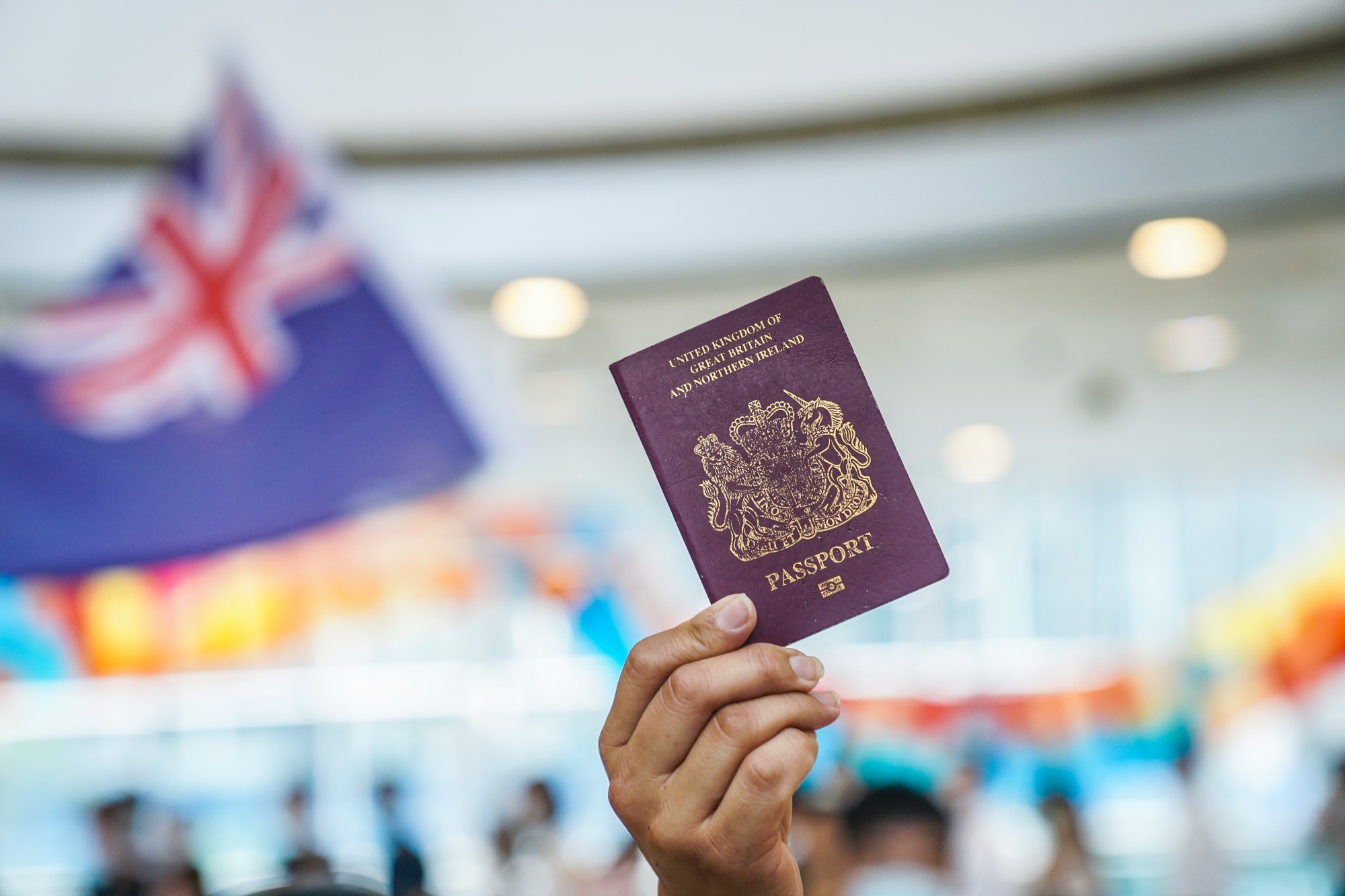 A demonstrator shows a British National (Overseas) passport during a protest at the International Finance Center&nbsp;shopping mall in Hong Kong, on May 29.