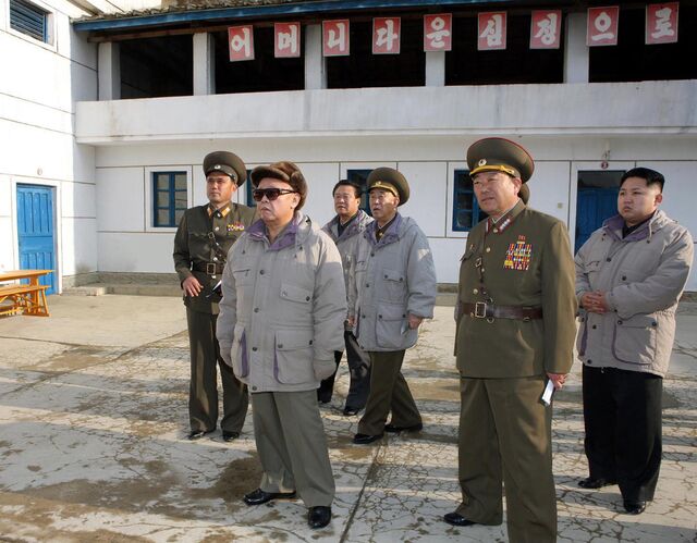 Kim Jong Il and Kim Jong Un inspect military facilities in North Korea in an undated photograph.