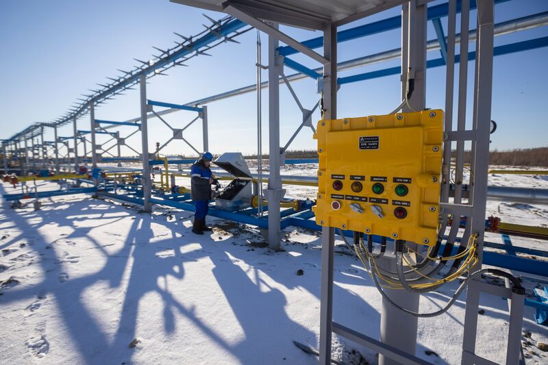 A worker checks the horizontal flare system by a gas well at an oil, gas and condensate field&nbsp;in the Lensk district of the Sakha Republic, Russia.