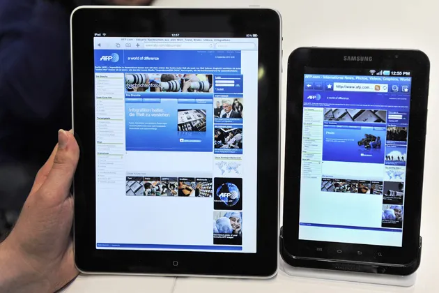 An Apple iPad next to Samsung's new tablet device, the Galaxy Tab