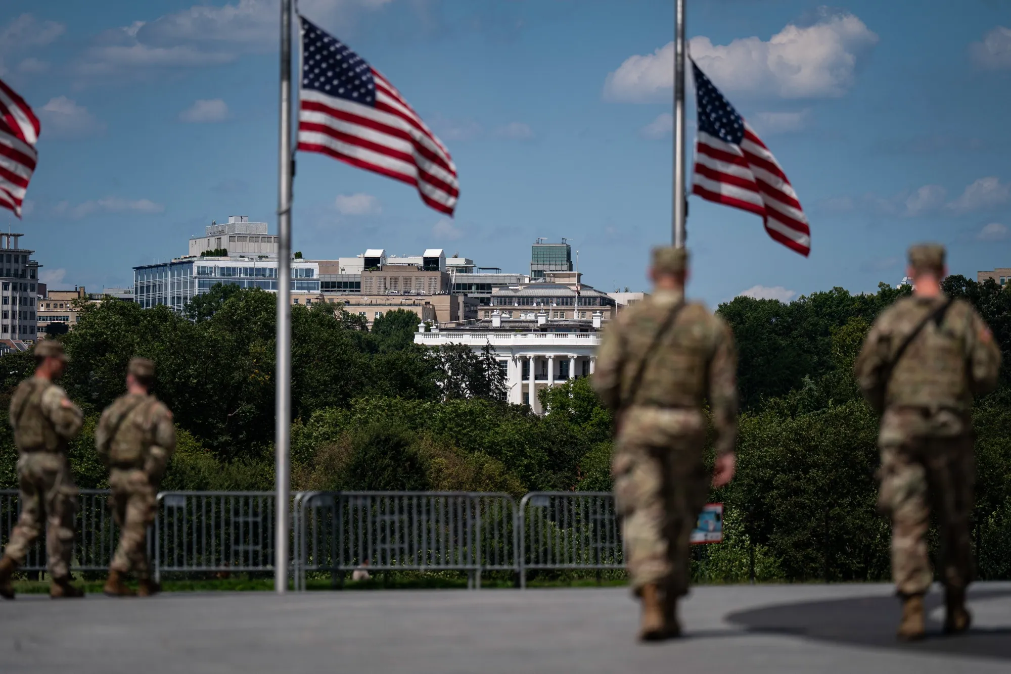 The White House past members of the West Virginia National Guard in Washington, DC, US, on Thursday, Aug. 28, 2025. President Donald Trump threatened that prosecutors would seek the death penalty for anyone found guilty of murder in Washington, DC, a move that would escalate his crime crackdown in the nation's capital.