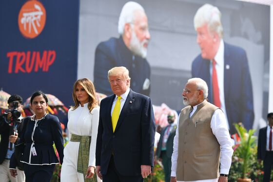 Trump Met by Modi’s Promised Pageantry On Arrival in India