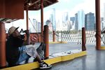 A man drinks water while riding on the Staten Island Ferry&nbsp;on July 21.