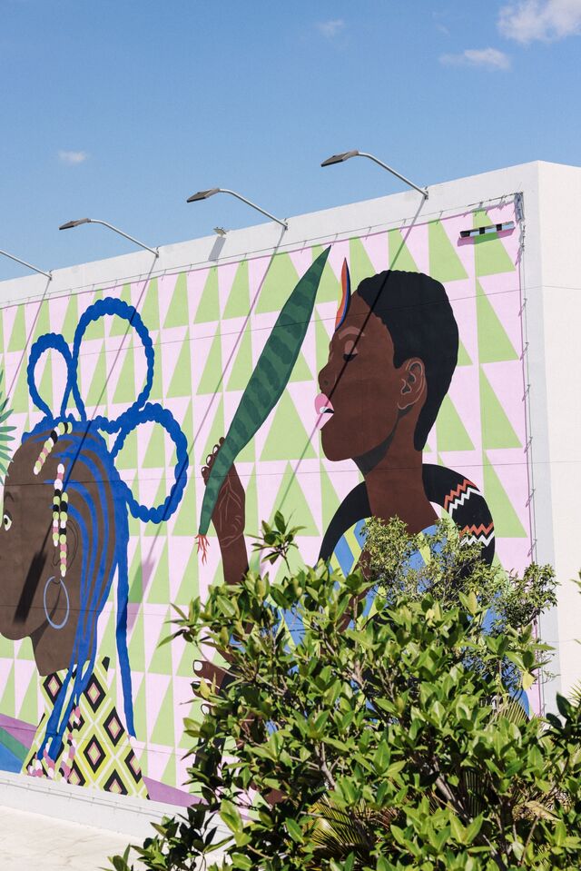  Brazilian Artist Criola's 'Interdimensional Portal,' depicts four figures in profile, facing each other in a mirrored disposition. 