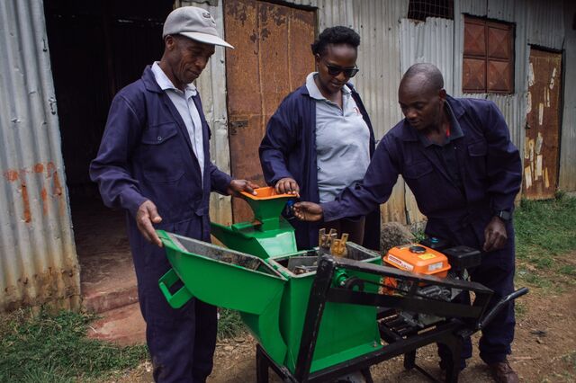 After re-examining the collected waste to keep out unwanted items, David Kinyanjui and his coworkers turn on a blender to grind organic waste into smaller pieces.