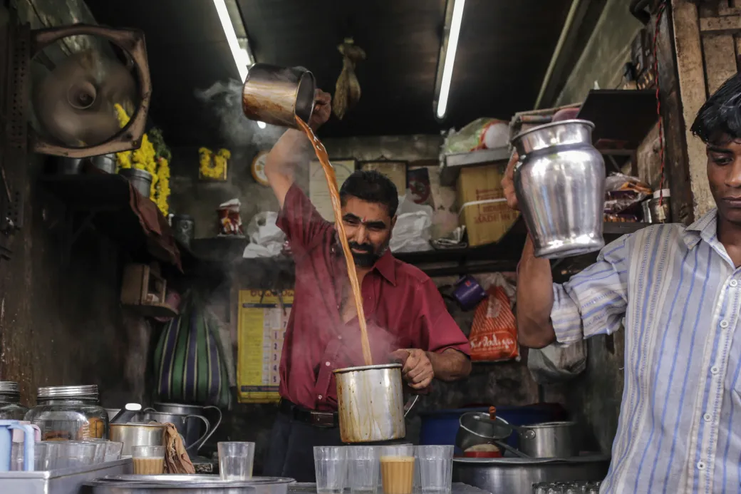 A vendor prepares chai in Mumbai.
