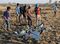 Workers Attend The Crash Site Of Ethiopian Airlines ET302 Flight To Nairobi