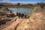 Farmers at a dried river bank near Saidia, Morocco. The country faces acute droughts every two to three years.