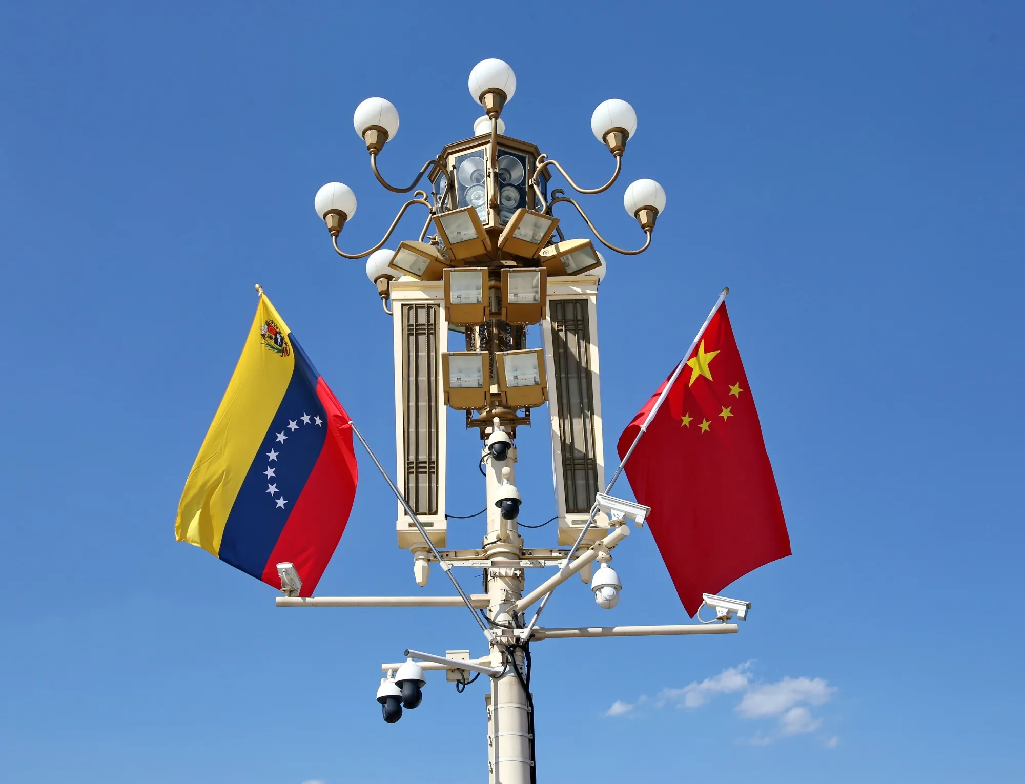 The national flags of Venezuela and China flutter inTian'anmen Square, Beijing, on Sept. 12.
