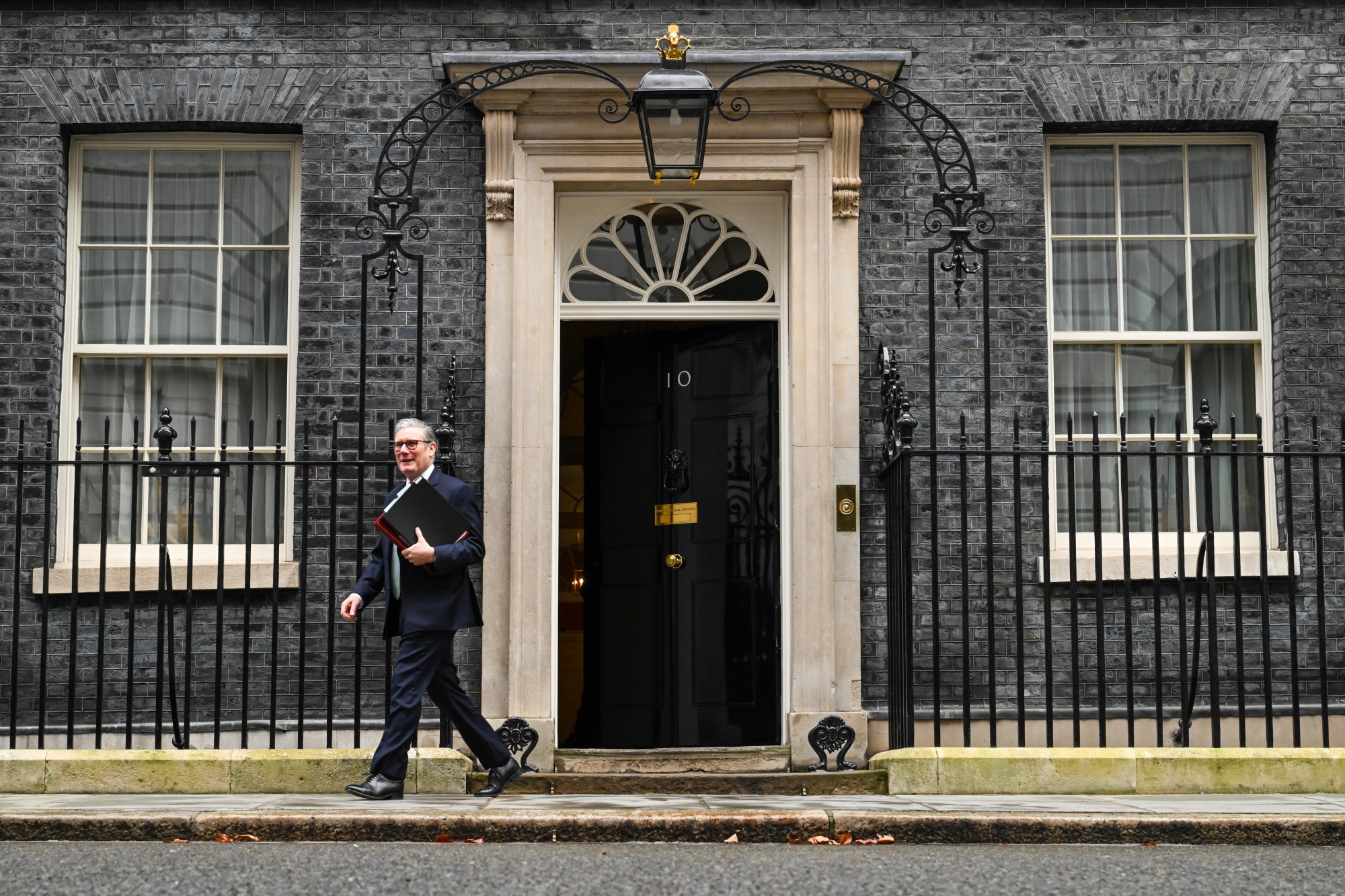 Keir Starmer, UK prime minister, leaves 10 Downing Street to attend Prime Ministers Questions in London, UK, on Wednesday, Feb. 11, 2026. The UK prime minister's position is seen as safe for the immediate future after every member of the cabinet on Monday publicly backed him to stay in his job, including Wes Streeting.