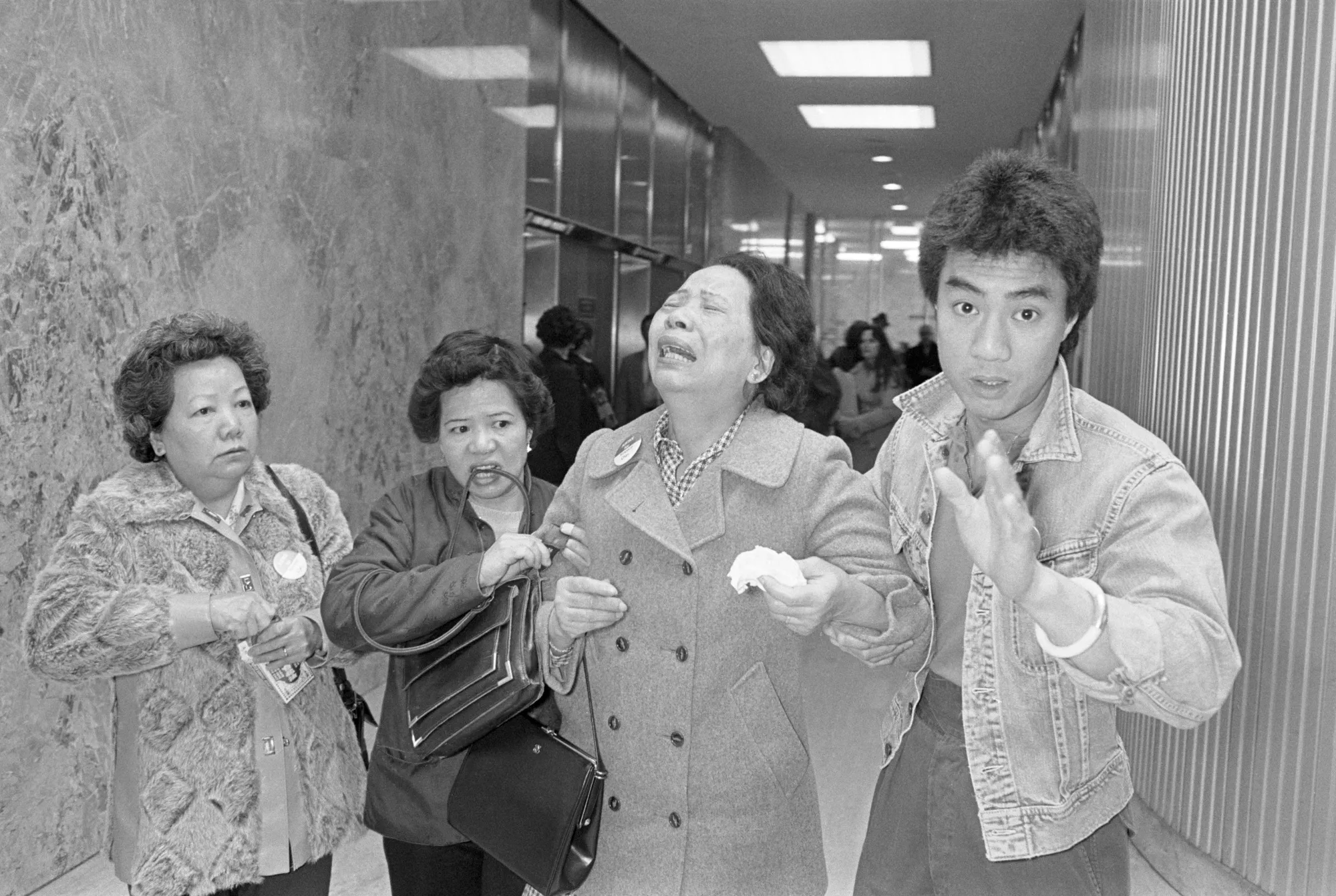 In 1982, a Chinese American named Vincent Chin was brutally beaten to death by two recently laid off autoworkers who’d mistaken him for Japanese. Above, his mother&nbsp;Lillie Chin&nbsp;breaks down while leaving Detroit's City County Building. She had asked for a tougher sentence of 15 years in prison for the men, who were sentenced to three years probation. Asian-American activists today fear similarly light punishments for recent crimes in U.S. Chinatowns.&nbsp;