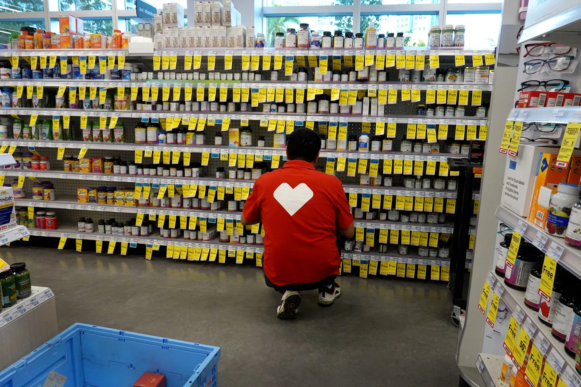 A worker&nbsp;stocks shelves in a CVS pharmacy store in Miami.