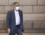 Haruhiko Kuroda, governor of the Bank of Japan (BOJ), wears a protective mask as he arrives at the central bank's headquarters in Tokyo, Japan, on Friday, May 22, 2020.