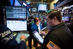 Traders work on the floor of the New York Stock Exchange (NYSE) in New York, U.S.
