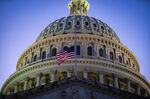 The American flag flies at half staff at the U.S. Capitol to mark the more than 500,000 U.S. Covid-19 deaths.