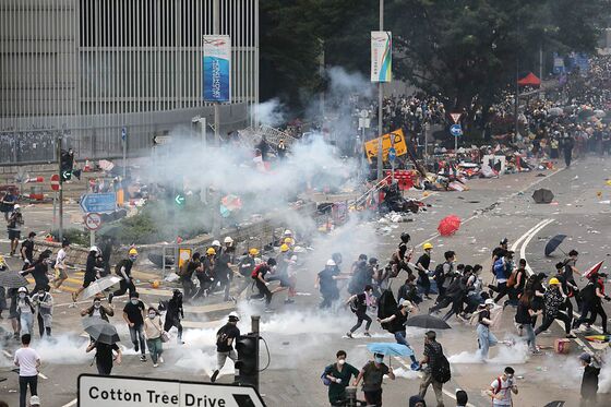 Hong Kong Markets Roiled by Interbank Rate Squeeze Amid Protests