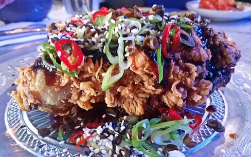 Guest fry: General Tso's glaze, chili, spring onion, sesame seeds and pickled green beans at Chick 'n' Sours.