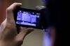 A member of the media films the closing price of the Nikkei 225 Stock Average displayed on a screen after a ceremony marking the last trading day of the year at the Tokyo Stock Exchange (TSE), operated by Japan Exchange Group Inc. (JPX), in Tokyo, Japan, on Friday, Dec. 28, 2018. Japanese shares fell, with the Topix index capping its worst annual performance since 2011, in a year that saw U.S.-China trade tensions deal a heavy blow to investor sentiment.