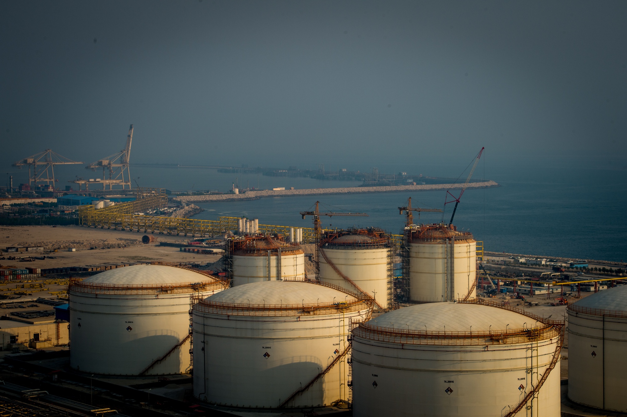 Storage tanks for petrochemicals stand&nbsp;beside the Persian Gulf in Asaluyeh, Iran.