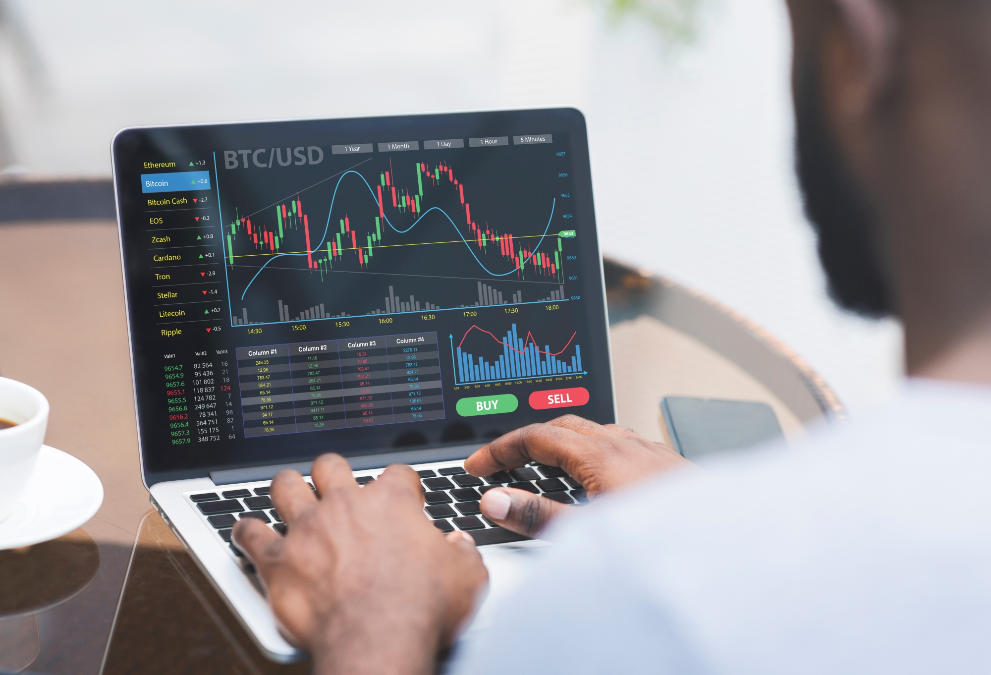 Cropped of black businessman analysing market online on laptop