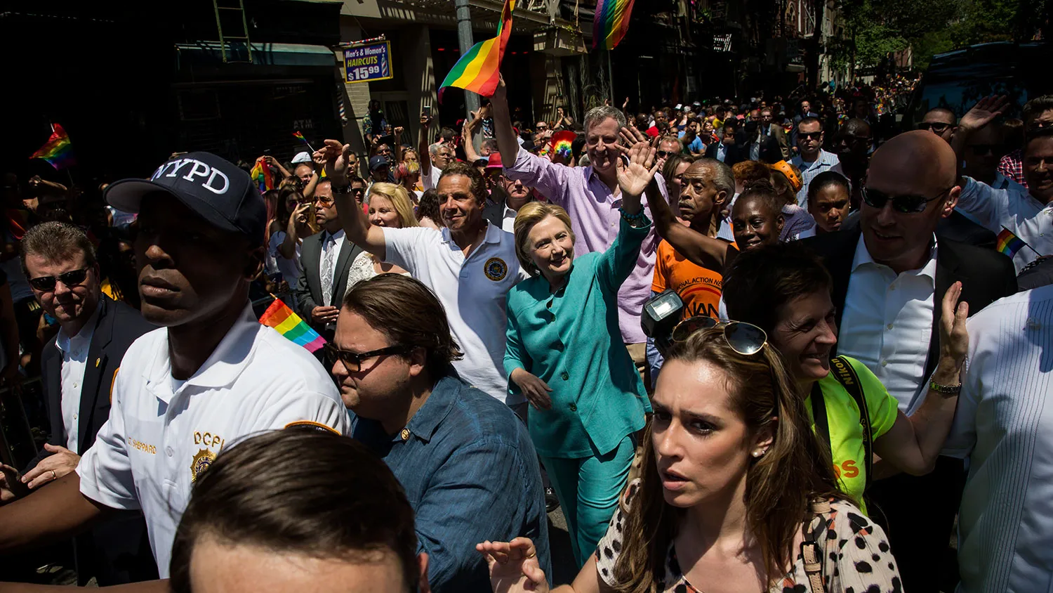 New York Governor Andrew Cuomo, former Secretary of State Hillary Clinton, Al Sharpton, and New York Mayor Bill de Blasio walk during the New York City Pride March on June 26, 2016, in New York City.
