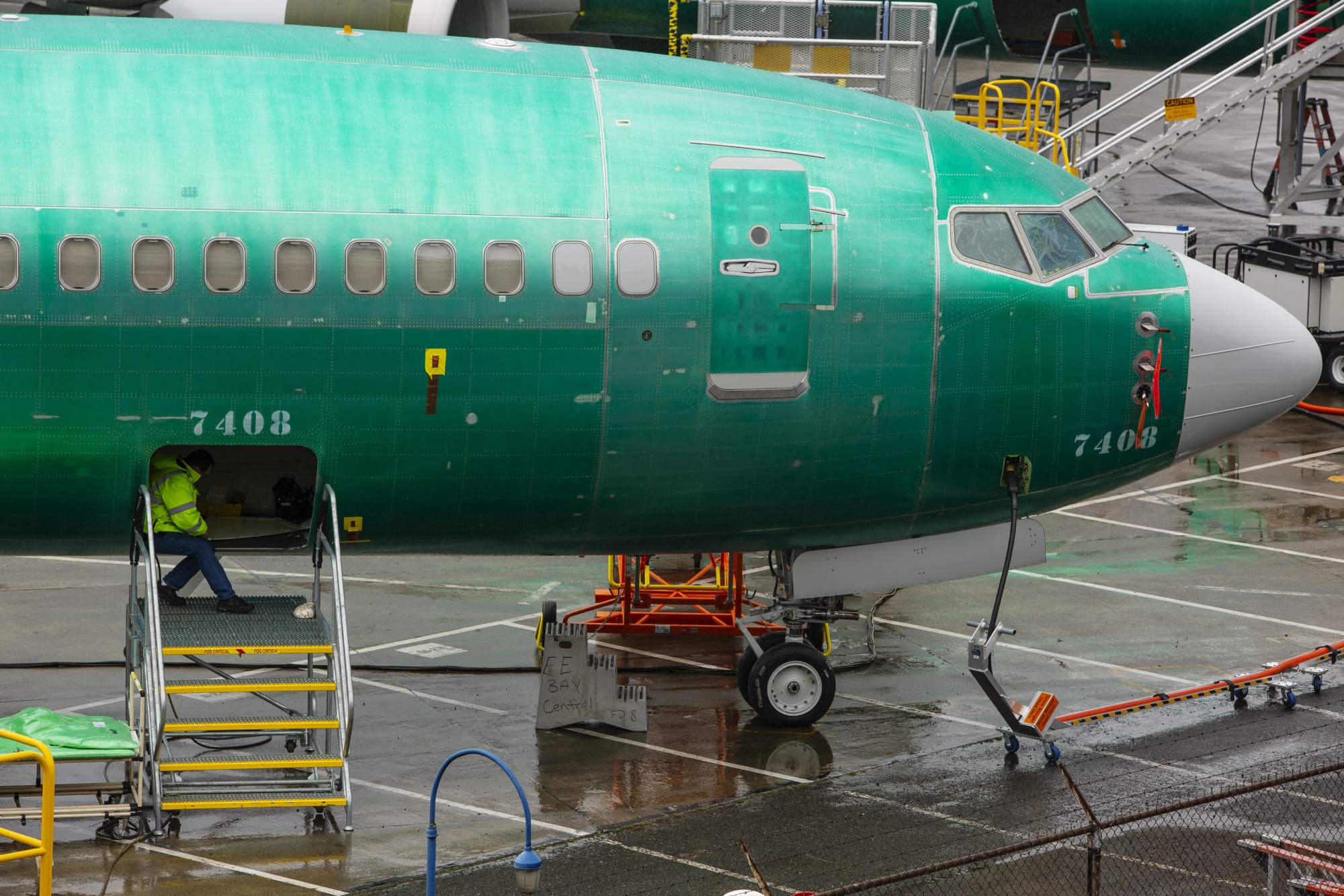 An employee works on a 737 Max 8 plane at the Boeing manufacturing facility in Renton, Washington.